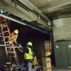 Mechanical Systems crew replacing lighting at Powell Station.