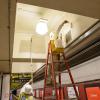 Paint Shop crew painting ceiling in Powell Station.