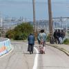 Pedestrians walking along Hunters Point Bouelvard