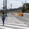 Pedestrian walking along Evans Avenue