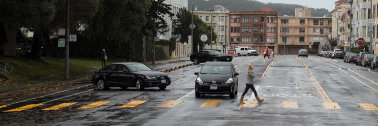 Woman crossing Bay Street in new high visibility school crosswalk