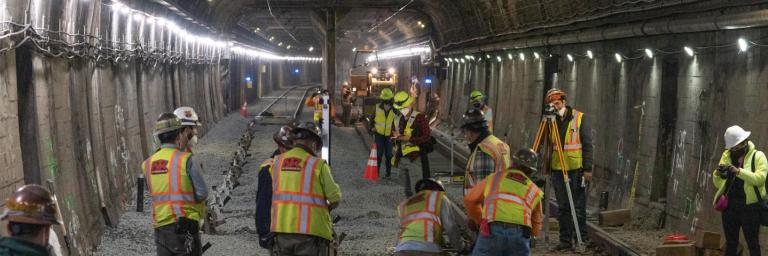 Workers laying new track in the Twin Peaks tunnel