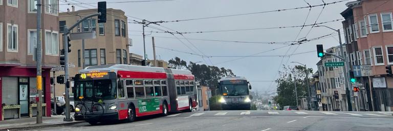 Muni buses travel through Mission at Highland intersection