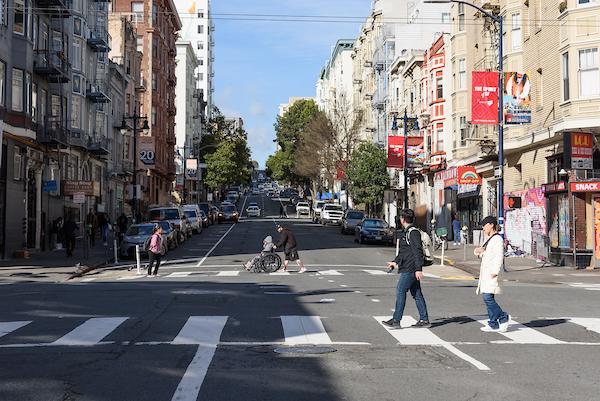 Image of people crossing the street downtown