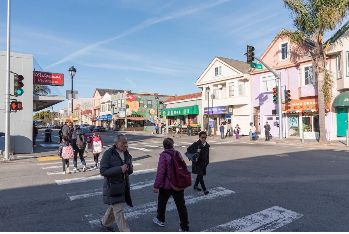 Image of people crossing the street on San Bruno Avenue