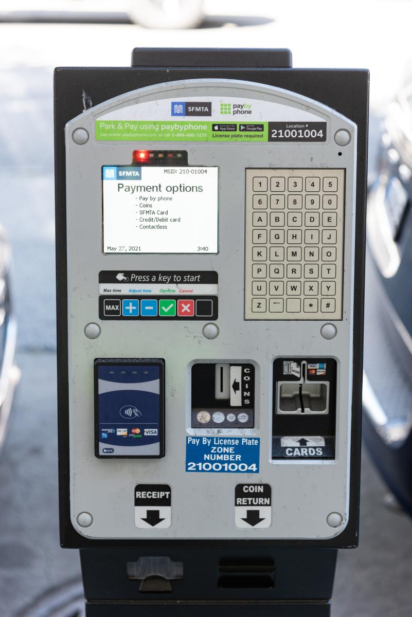 Close-up of view of our new multi-space pay stations. Screen says "payment options" and lists available options in bullet points.