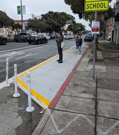 New widened sidewalk on Geary at 25th Ave inbound bus stop.