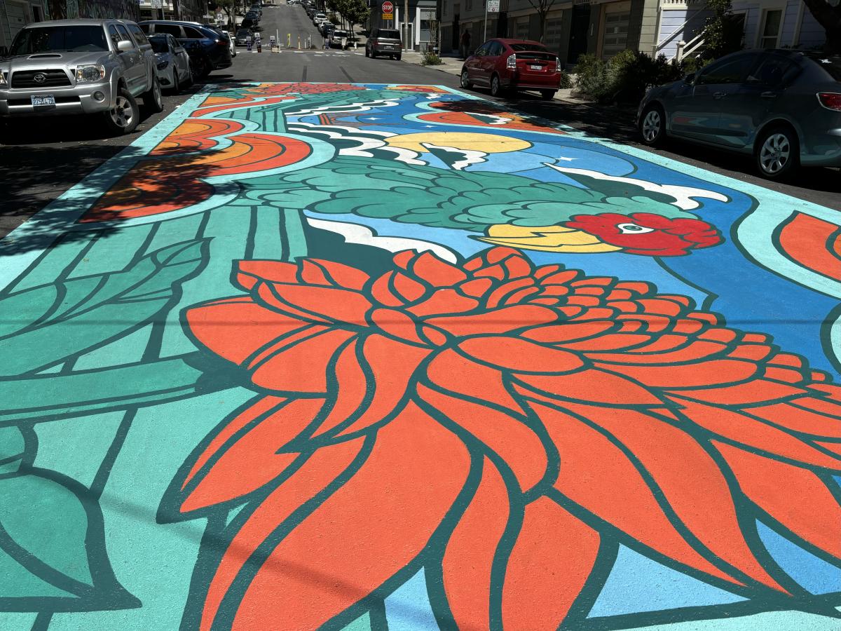 The Lyon Slow Street mural. Features a colorful flower pattern. 