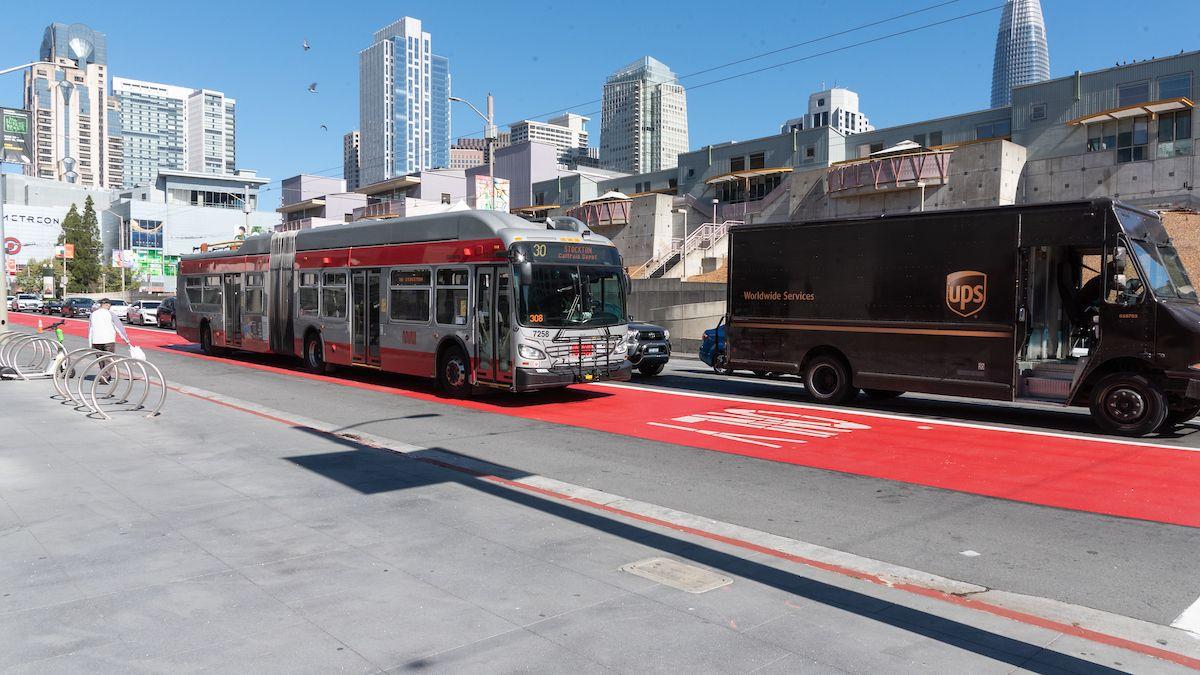  A photo of the 30 Stockton passing by the Yerba Buena Center for the Arts in San Francisco, travelling in a red transit lane.