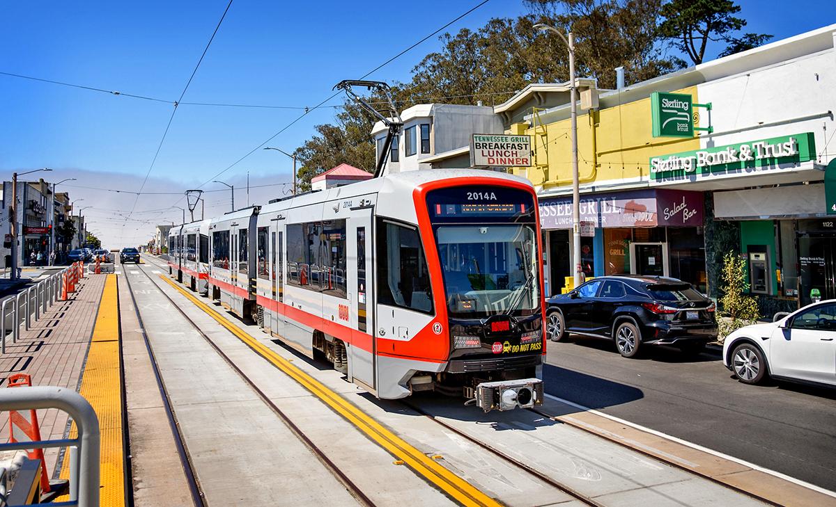 An L Taraval train runs on new tracks along Taraval as operators train for the return of service.