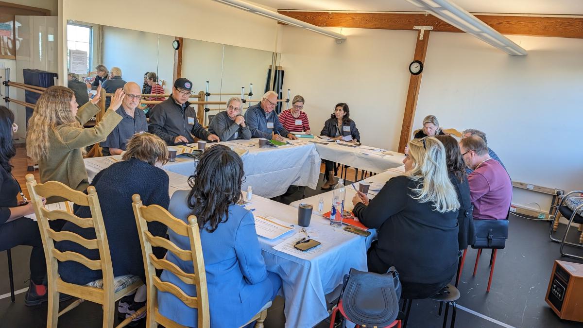 Merchants in the Geary Small Business Working Group sit around a table during their kick-off meeting.