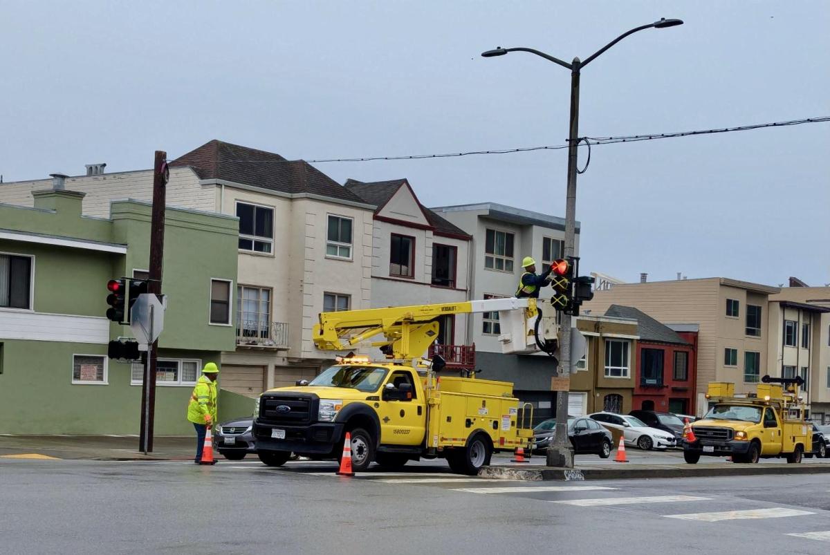 SFMTA Signal Shop crews activate a traffic signal at 41st Avenue and Lincoln Way.