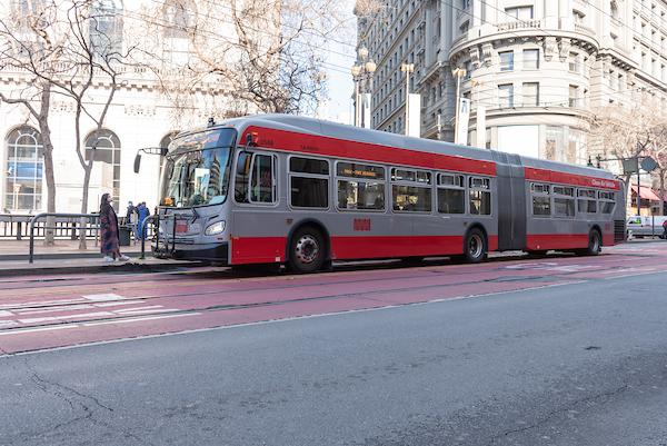 Riders wait for a bus on Market Street