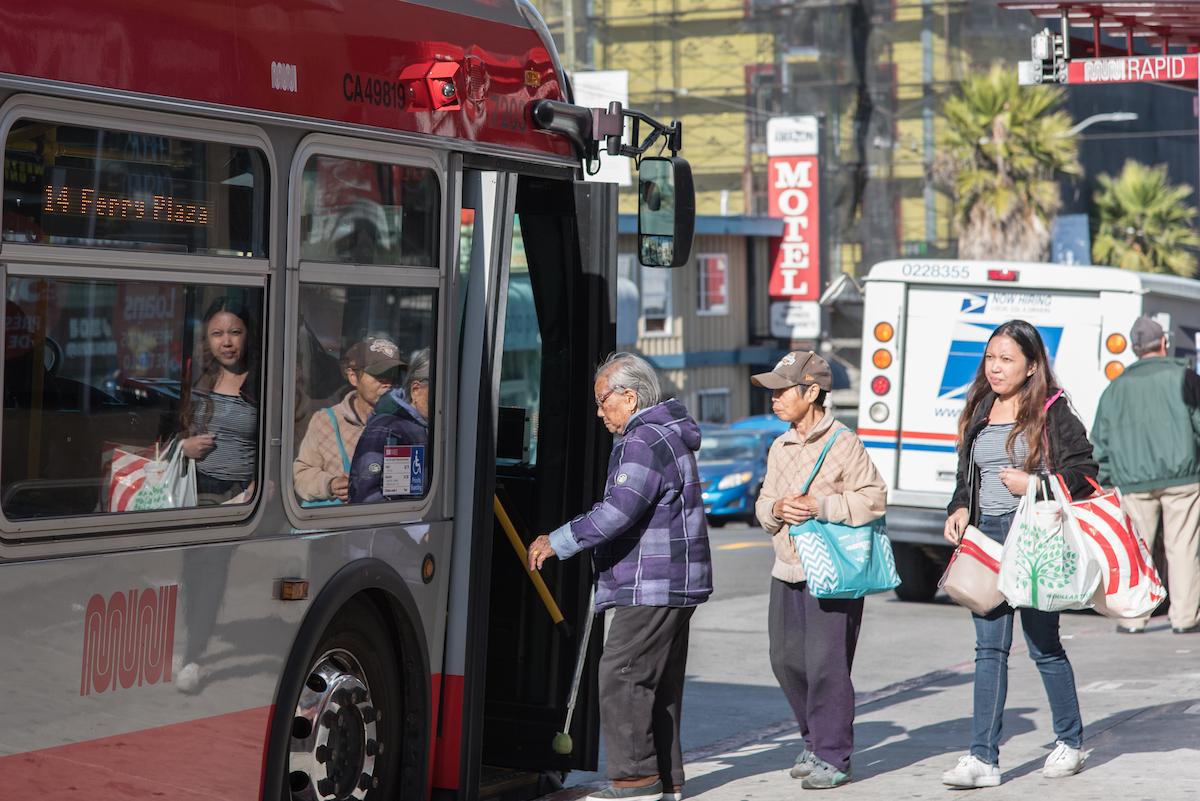 Seniors and others board the bus in the Excelsior District.