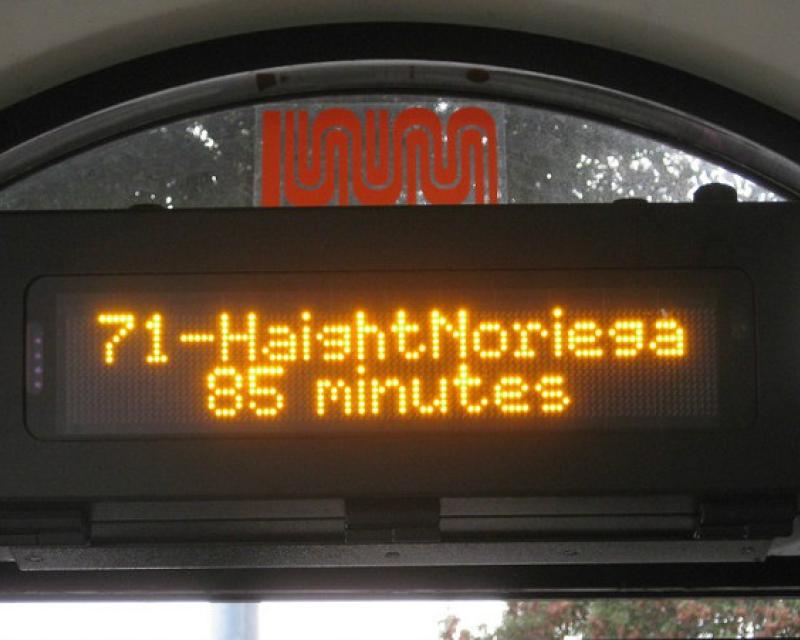 Digital screen at a Muni shelter showing the next bus arrival time.