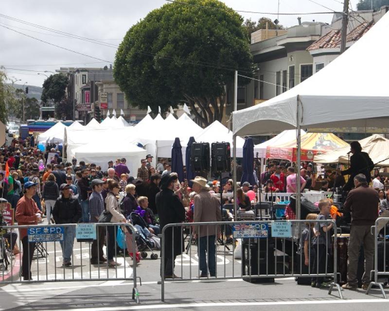 A crowd of people fills and tents fill Diamond Street during the 2014 Glen Park Festival.