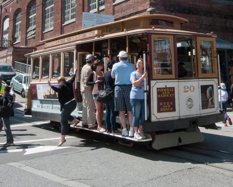 People alighting from Cable Car at Washington and Mason Streets