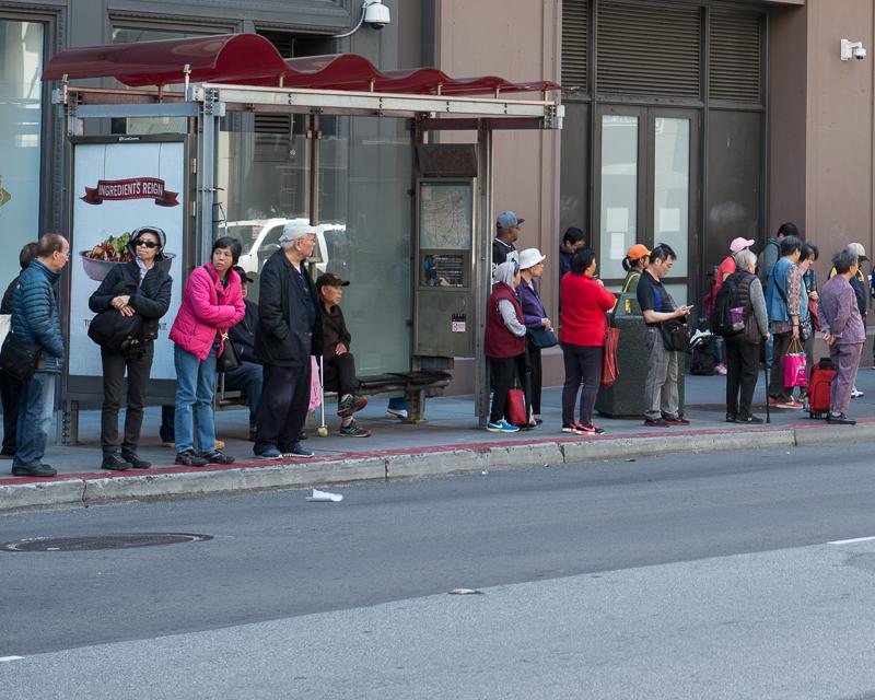 Group of people waiting for a bus