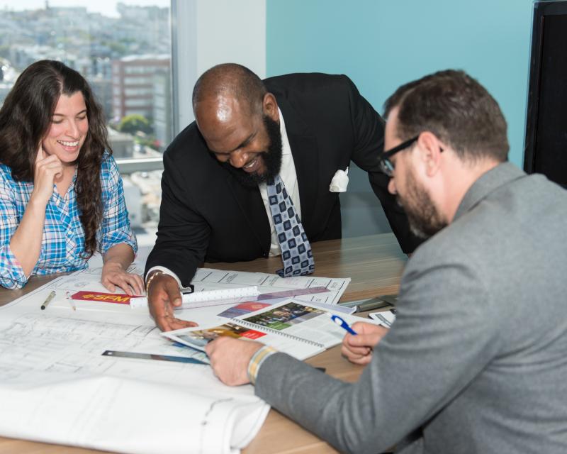 planners discussing drawings