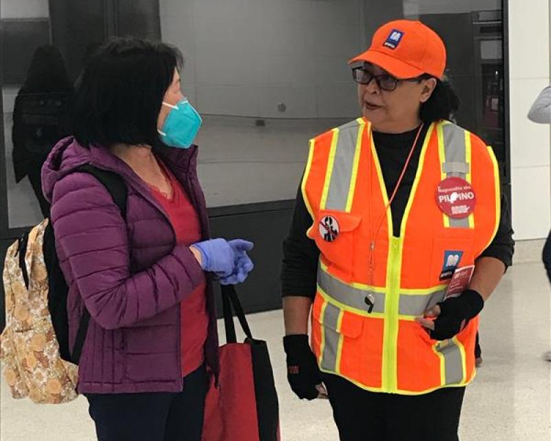 SFMTA ambassador helping customer.