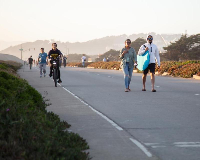 People walking, biking, and rolling along the Upper Great Highway when closed to vehicles