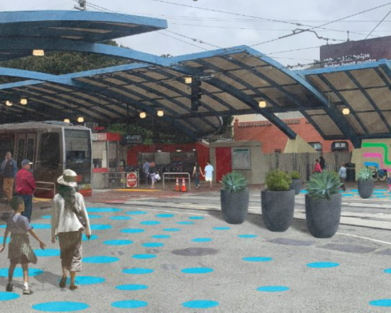 People walking in a plaza outside West Portal Station with blue dots and planters.