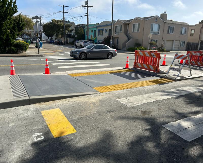 Transit Island and curb ramp under construction at Gennessee St and Judson Ave