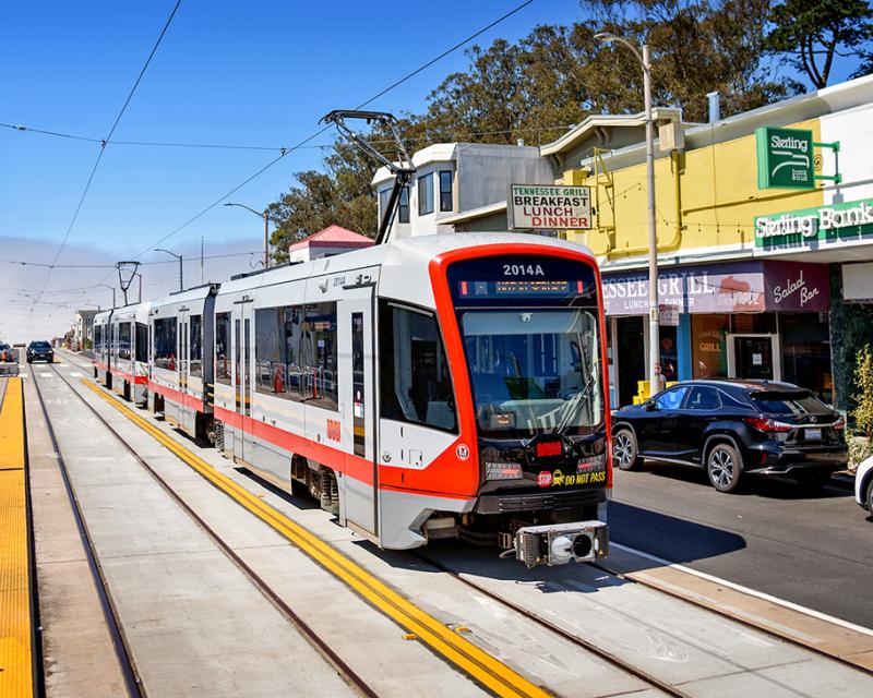 An L Taraval train runs on new tracks along Taraval as operators train for the return of service.