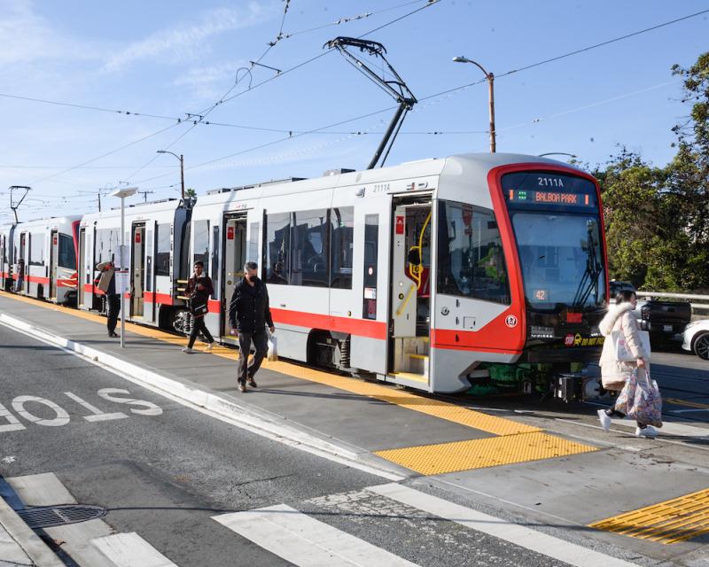 M Ocean View riders step off the train onto a new boarding island at its final outbound stop on San Jose and Niagara avenues.