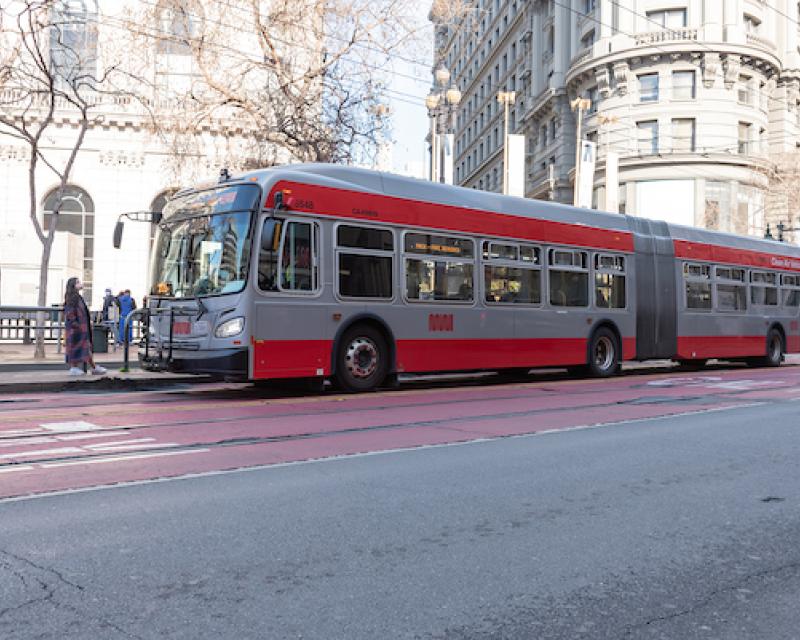 Riders wait for a bus on Market Street