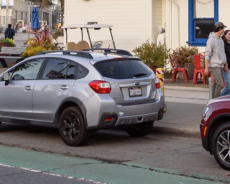 Cars parked inside a bike lane