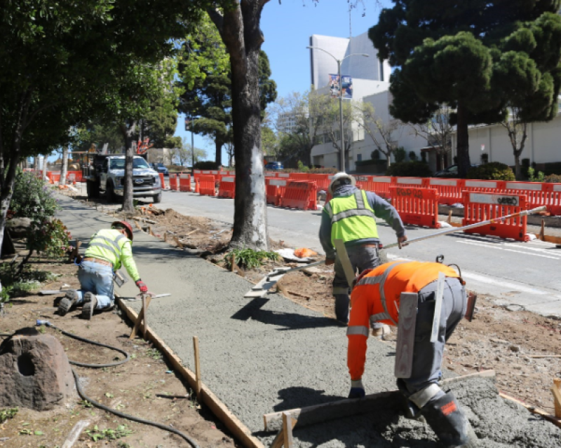 Esquivel Grading and Paving crew members pouring concrete along sidewalk at Geary Boulevard at Laguna. Photo courtesy of Esquivel Grading and Paving     