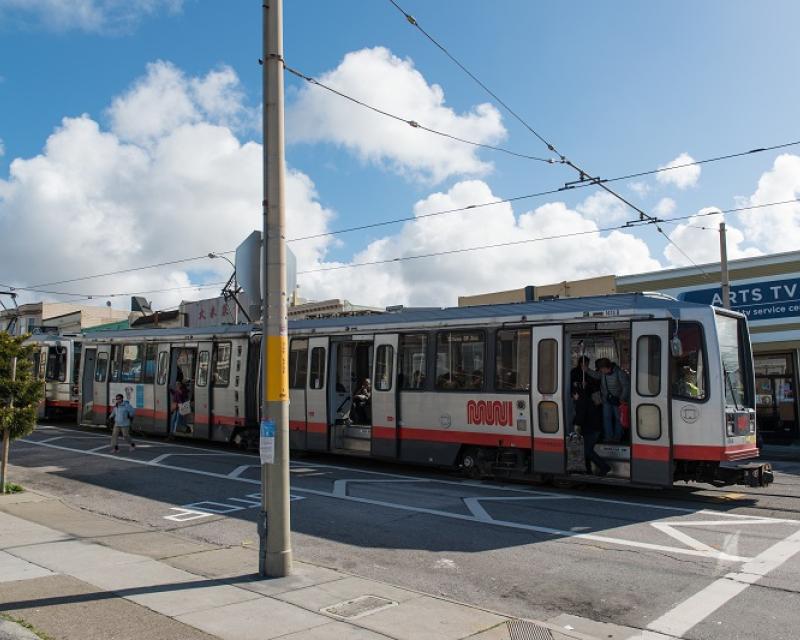 People alighting L Taraval train using "clear zones" that improve safety.