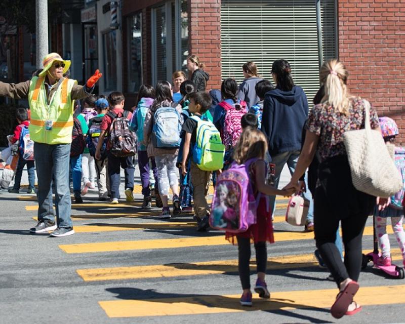 Kids crossing the street.