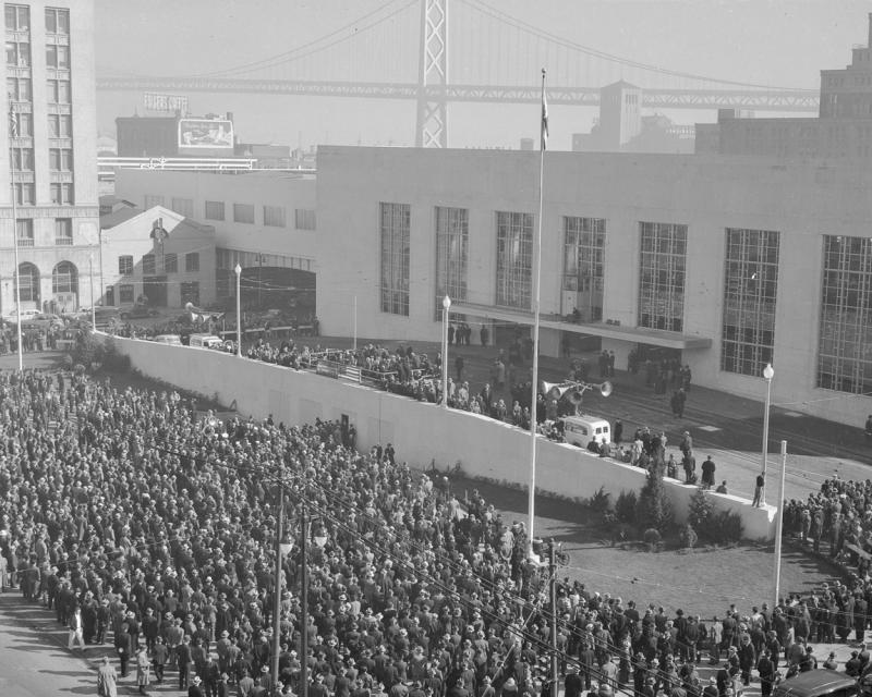 crowd with old transbay terminal and bay bridge
