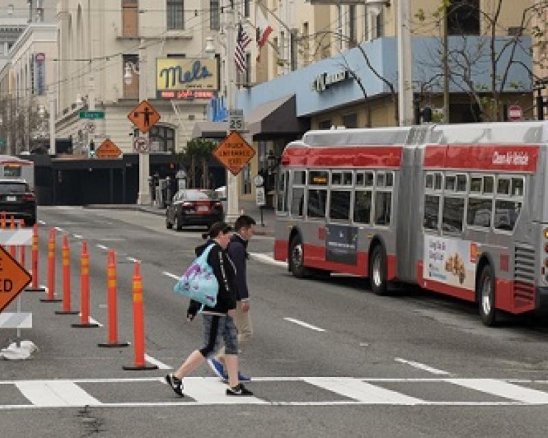 A 49 coach stopping on Van Ness.