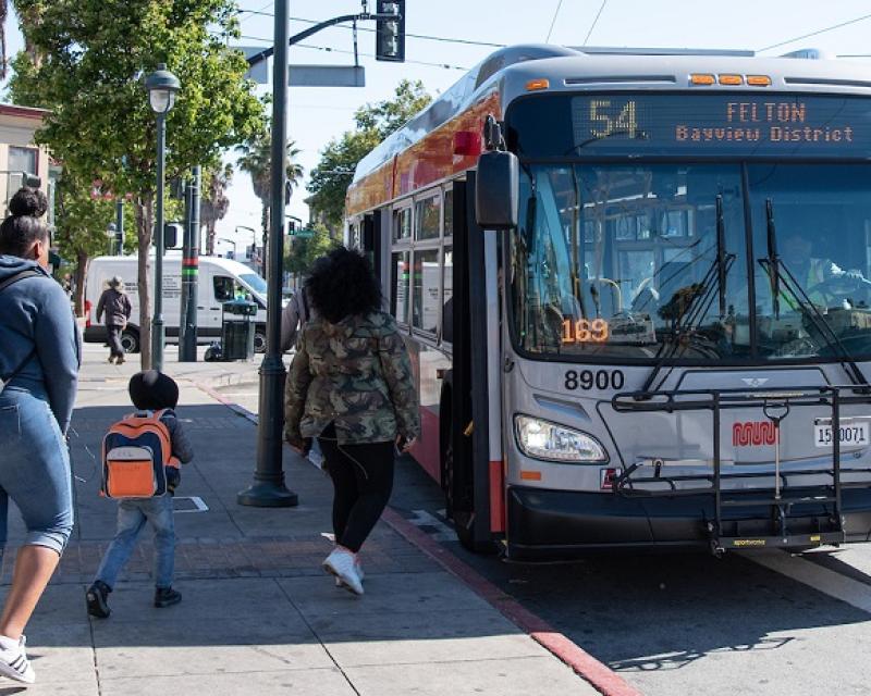 People in Bayview boarding a 54 coach.