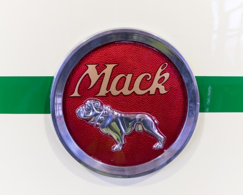 photo of Mack Truck Company logo on front of bus