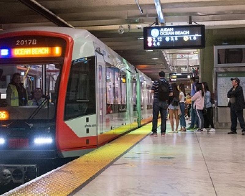 Train picking people up in the subway.