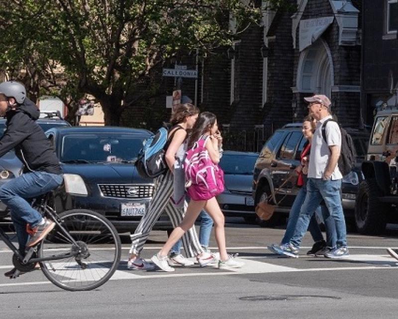 people using crosswalks