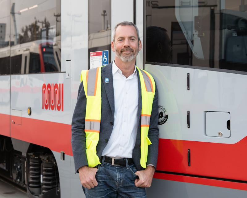 Jeff Tumlin standing next to a LRV4