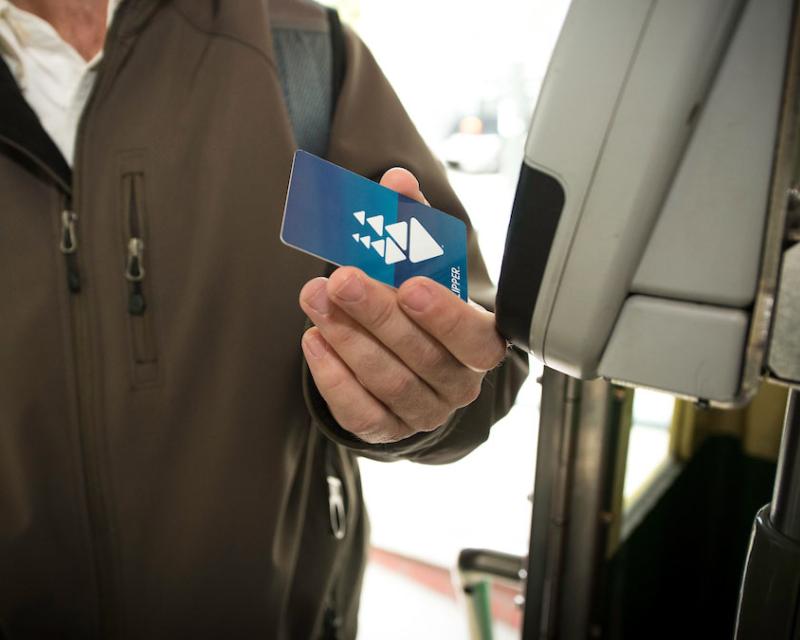 A customer pays their fare with a clipper card