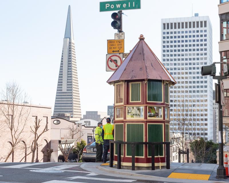 cable car signal tower with transamerica building in background