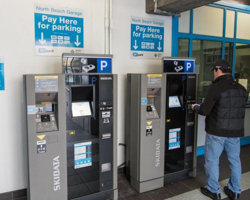 Customer using new PARCS kiosk at North Beach parking garage
