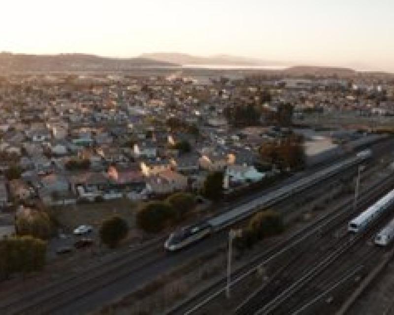 Photo of capitol corridor train and BART train in East Bay