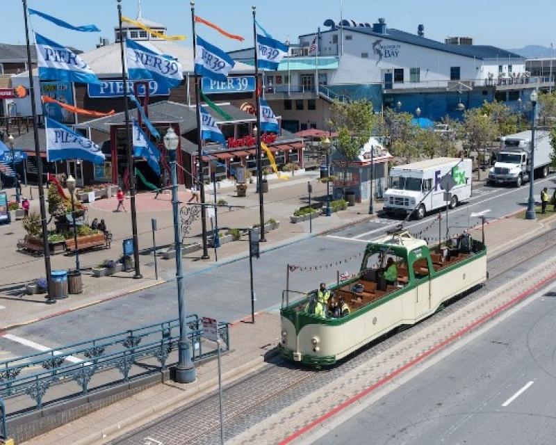 Photo of Pier 39 with historic "boat car" tram