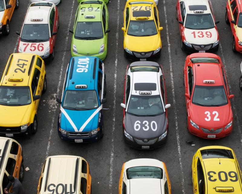 Bird's eye view of multiple taxis on the roadway