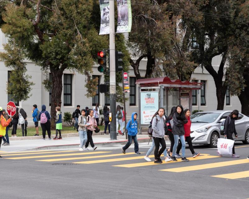 Children crossing street from their school